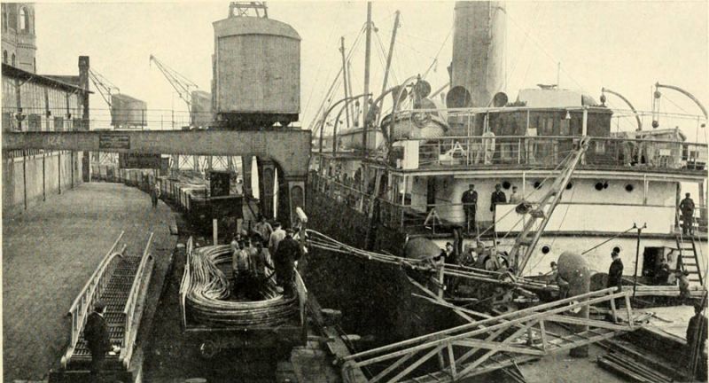 16. Loading a trainload of cable direct from cars into steamer. 